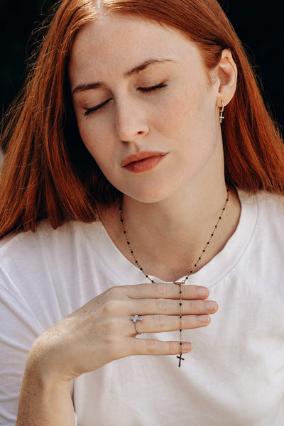 Religious necklace with pendant cross of the Virgin Mary