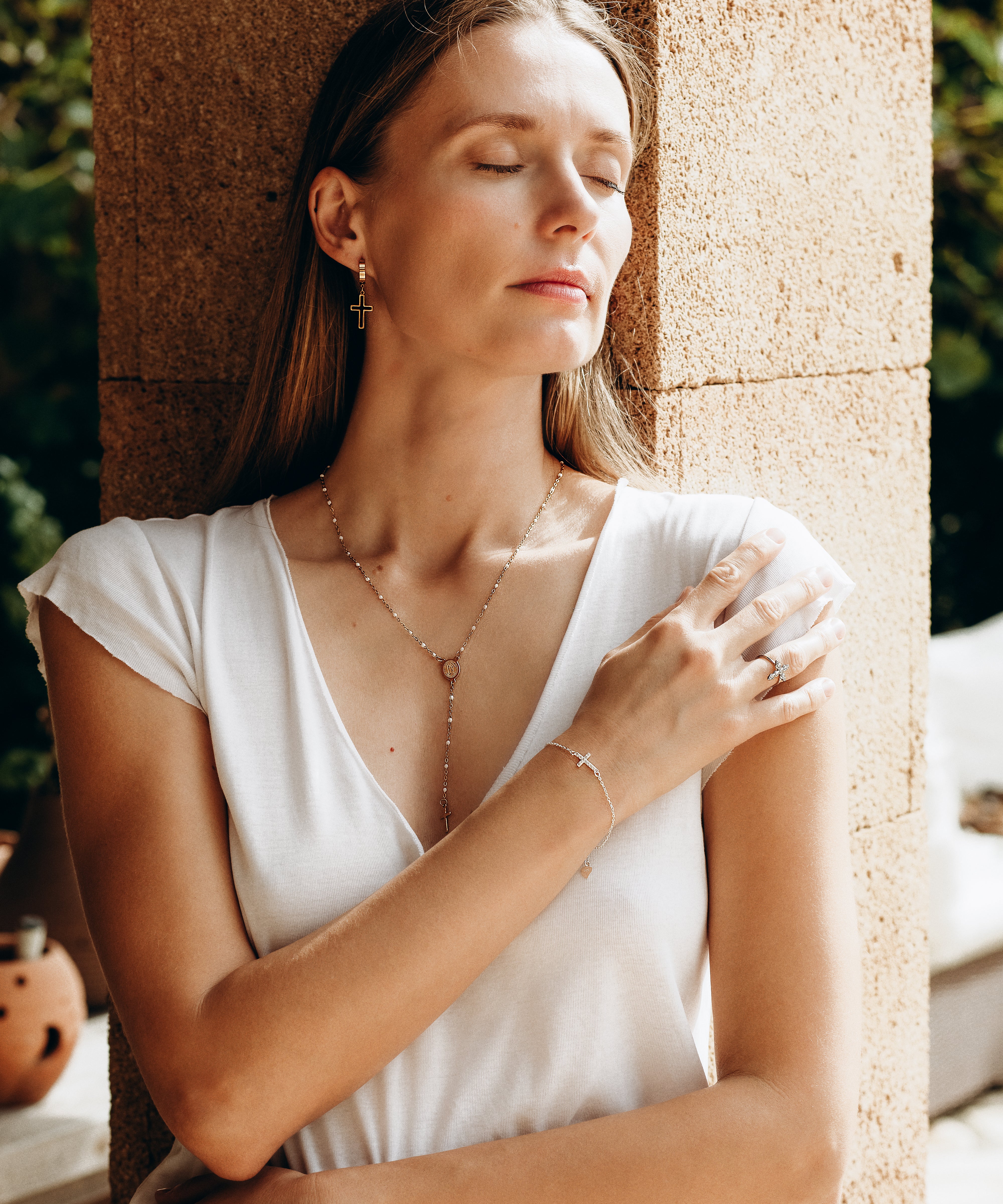 Religious necklace with pendant cross of the Virgin Mary