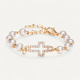 Armband mit Perlen aus Muschel und Kreuzanhänger