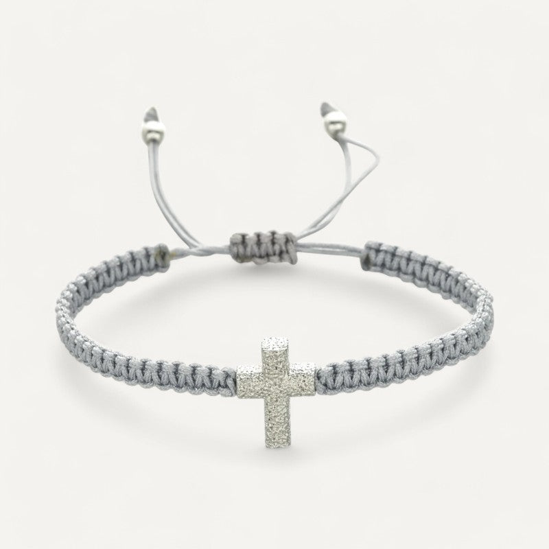 Adjustable braided bracelet with cross charm