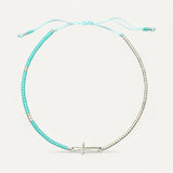 Standing charms bracelet with silver cross