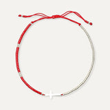 Standing charms bracelet with silver cross