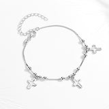 Triple silver cross bracelet