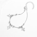 Triple silver cross bracelet
