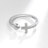 Silver cross and heart ring