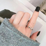 Silver cross and heart ring