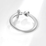 Silver cross and heart ring